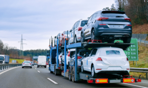 Fully Loaded Auto Shipping Truck Driving on Highway