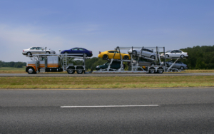 Side View of Hauling Truck Carriying Several Cars