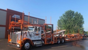 JMN Logistics & Transportation Truck in Front of JMN Building